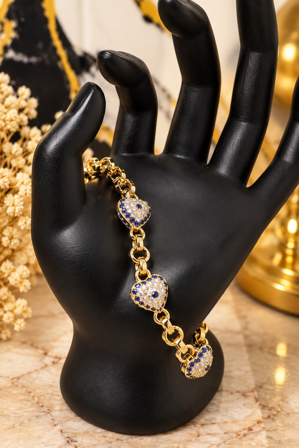 Pulsera de corazones con zirconias azules y transparentes en oro laminado 14k